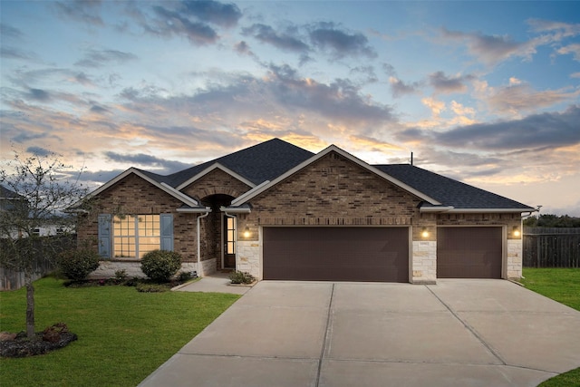 single story home featuring driveway, a shingled roof, an attached garage, fence, and a front yard