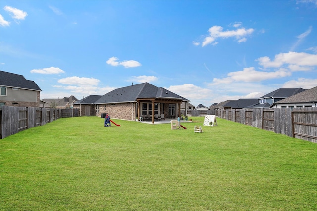 view of yard featuring a patio area and a fenced backyard