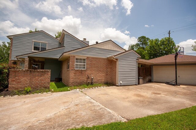 1523 Bamwick Dr, Houston, TX 77090 - view of front facade with brick siding and a chimney
