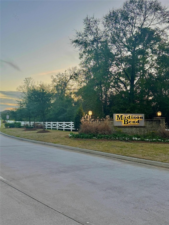 community sign with fence