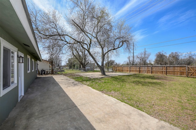 view of yard featuring a fenced backyard and a patio