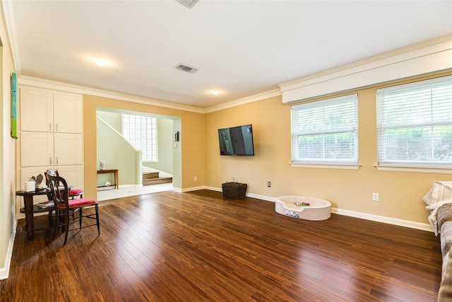 living area featuring dark wood-style floors, visible vents, ornamental molding, baseboards, and stairs