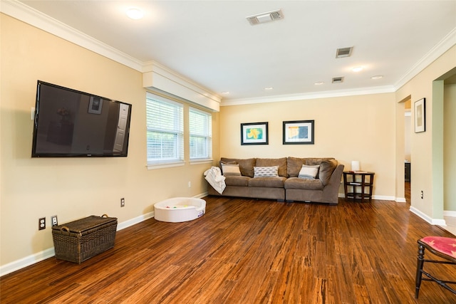 living room featuring crown molding, visible vents, and wood finished floors