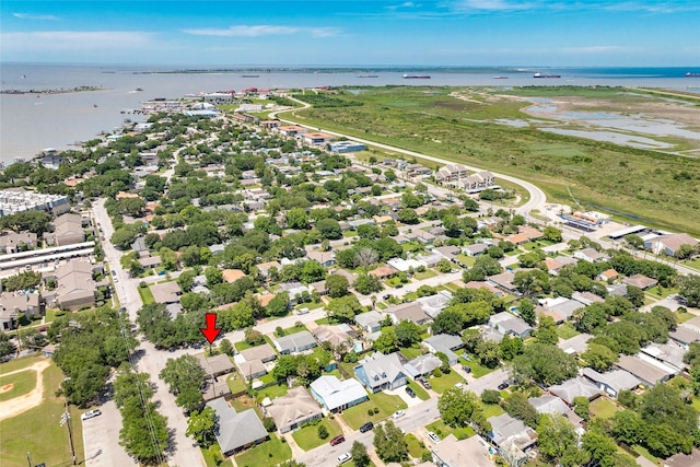 drone / aerial view with a residential view and a water view