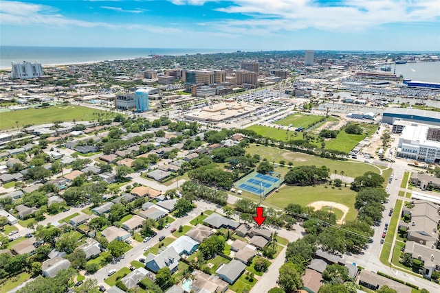 birds eye view of property with a water view and a city view