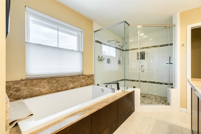 full bath with a stall shower, tile patterned flooring, and a garden tub