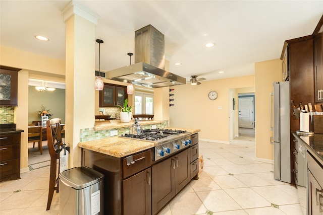 kitchen with stainless steel appliances, dark brown cabinets, island exhaust hood, and decorative backsplash