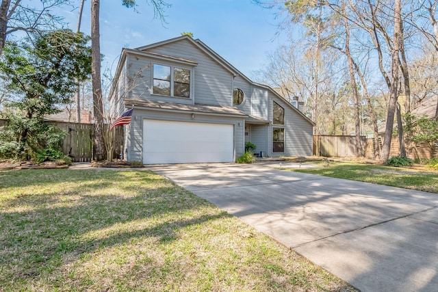 view of front of home featuring a garage, concrete driveway, a front lawn, and fence