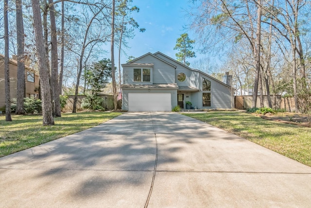 mid-century inspired home with an attached garage, concrete driveway, a front yard, and fence