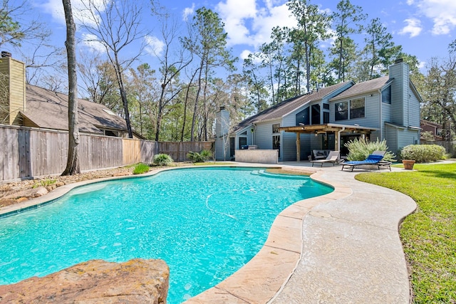 view of swimming pool featuring a patio area, a fenced backyard, and a fenced in pool