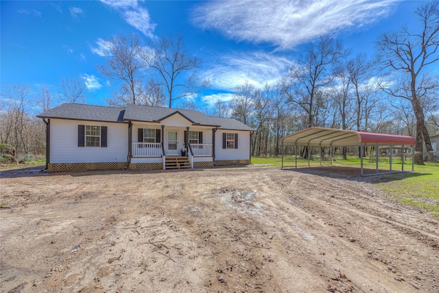 ranch-style house with covered porch and a carport