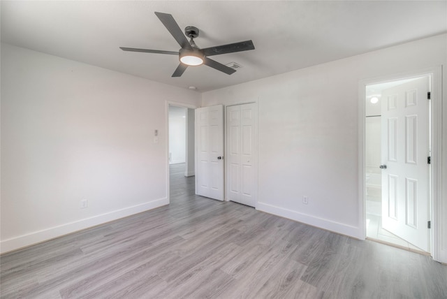 unfurnished bedroom with a ceiling fan, visible vents, baseboards, a closet, and light wood finished floors