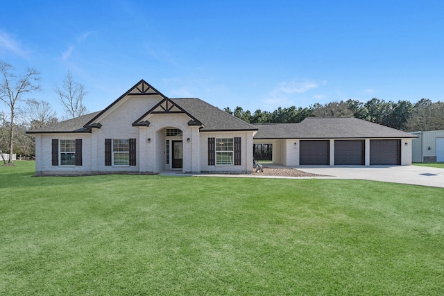 french provincial home with driveway, an attached garage, a front lawn, and a shingled roof