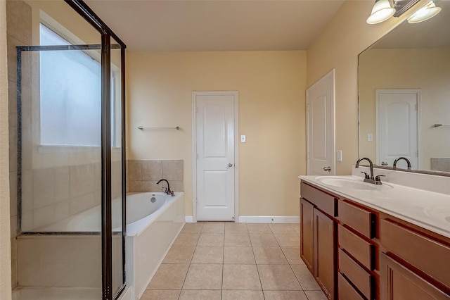 full bathroom with tile patterned floors, double vanity, a bath, and a shower stall