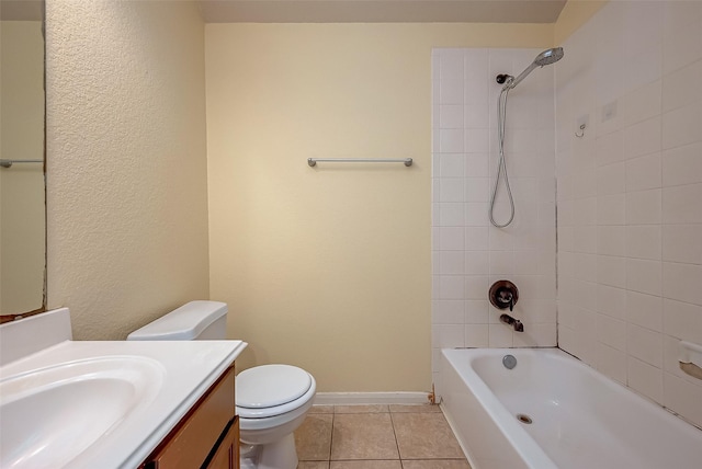 bathroom with baseboards, toilet, bathtub / shower combination, tile patterned floors, and vanity