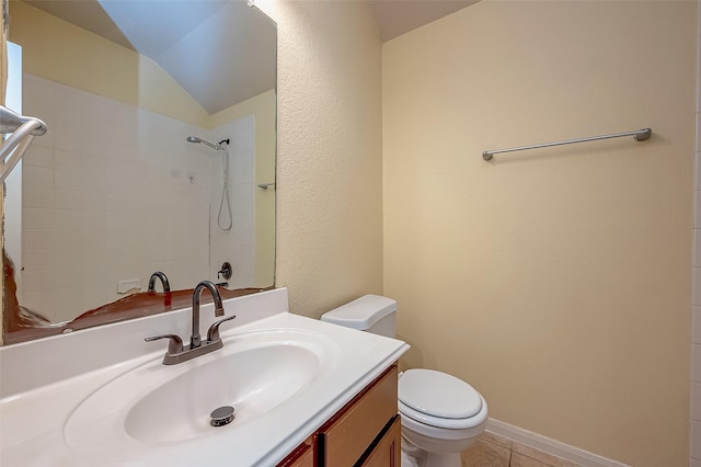 full bathroom with toilet, tile patterned flooring, lofted ceiling, walk in shower, and vanity