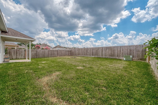 view of yard featuring a fenced backyard