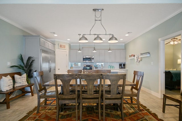 dining room featuring recessed lighting, ornamental molding, light wood-style floors, ceiling fan, and baseboards