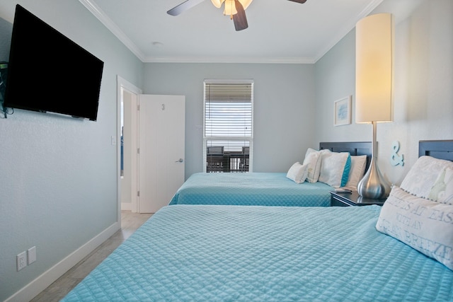 bedroom with ceiling fan, ornamental molding, and baseboards