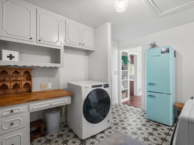 laundry room featuring washer / clothes dryer and light floors