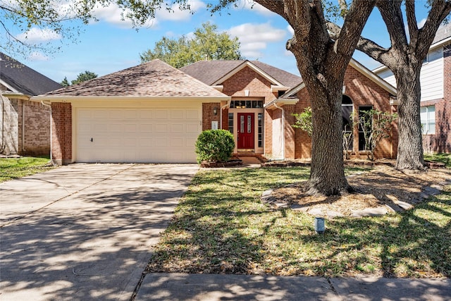 view of front facade with brick siding, an attached garage, driveway, and roof with shingles