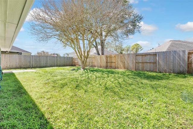 view of yard with a fenced backyard