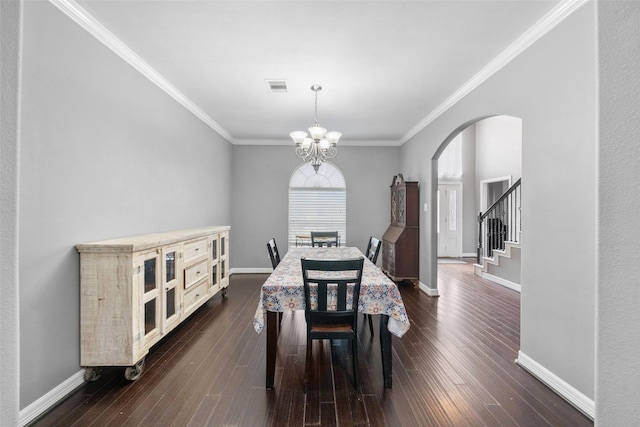 718 S Diamondhead Blvd, Crosby, TX 77532 - dining space with arched walkways, dark wood-style floors, crown molding, a chandelier, and stairs