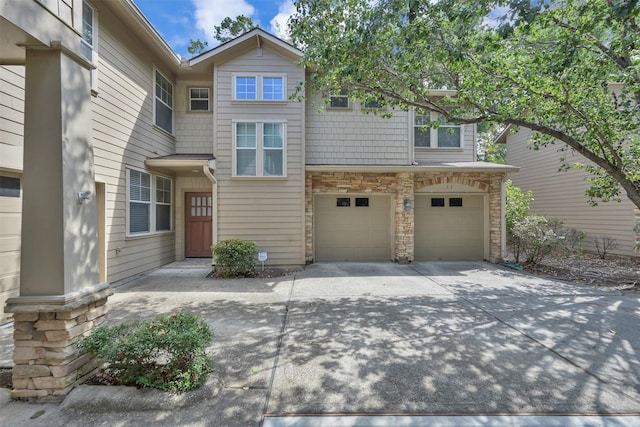 33 Stone Creek Pl, The Woodlands, TX 77382 - view of property with a garage, driveway, and stone siding