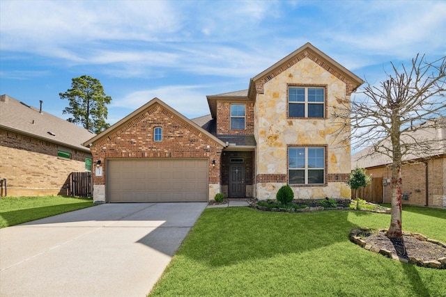 traditional home with fence, concrete driveway, a front yard, a garage, and stone siding