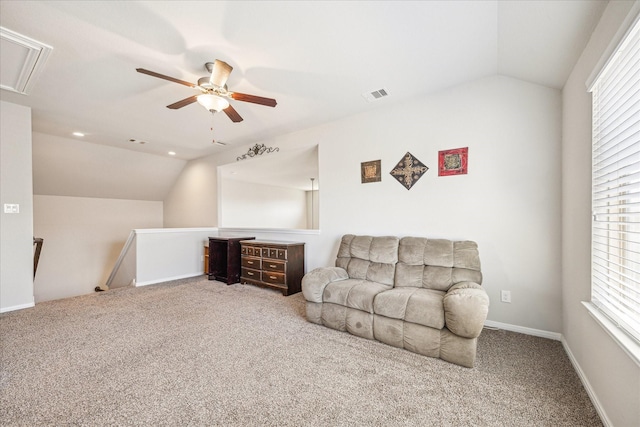 sitting room with visible vents, lofted ceiling, attic access, and an upstairs landing