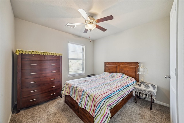 bedroom with light colored carpet, a ceiling fan, and baseboards