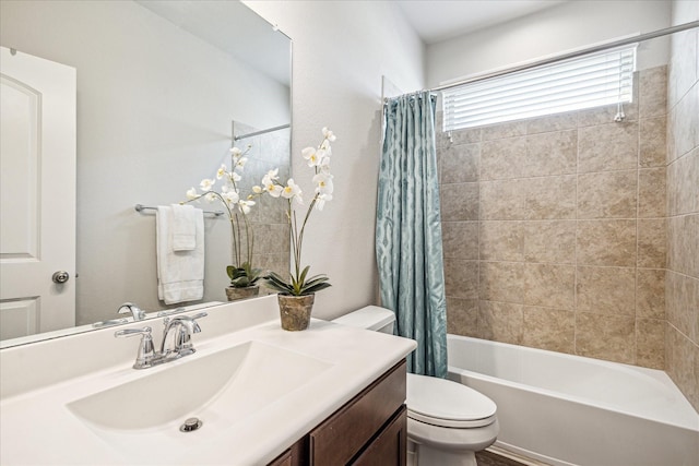 full bathroom featuring vanity, toilet, and shower / tub combo with curtain