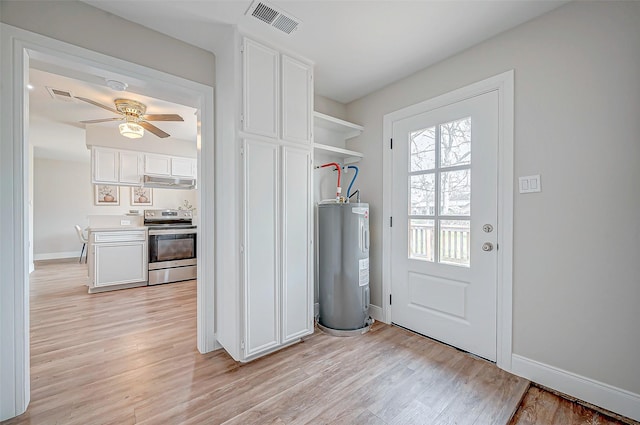 entryway with visible vents, light wood finished floors, and electric water heater