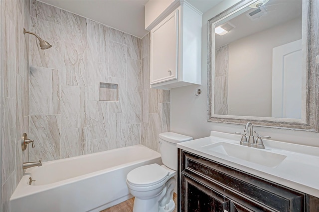 bathroom with visible vents, bathing tub / shower combination, toilet, and vanity