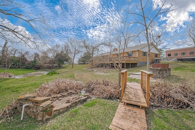 view of yard with stairway and a deck
