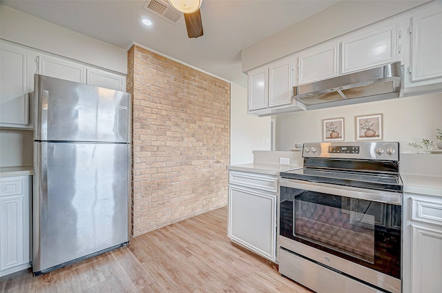 kitchen featuring light wood finished floors, appliances with stainless steel finishes, light countertops, under cabinet range hood, and white cabinetry
