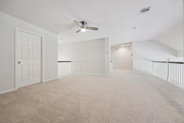 bonus room with a ceiling fan, baseboards, visible vents, and carpet flooring