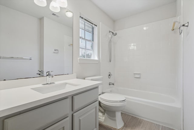 full bath with toilet, bathtub / shower combination, vanity, and visible vents