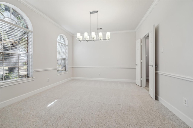 carpeted spare room featuring ornamental molding, visible vents, a notable chandelier, and baseboards