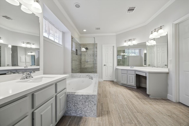 full bathroom featuring a sink, visible vents, ornamental molding, a jetted tub, and a shower stall