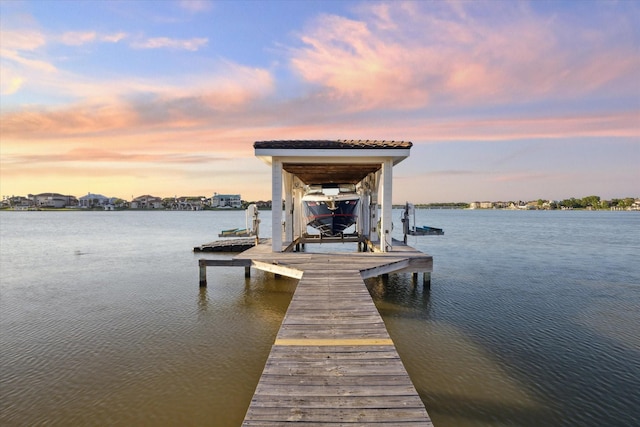 view of dock featuring a water view and boat lift