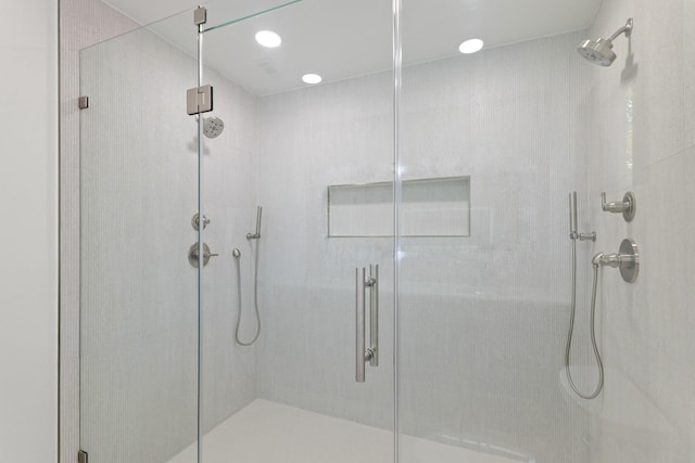 bathroom featuring a stall shower and recessed lighting