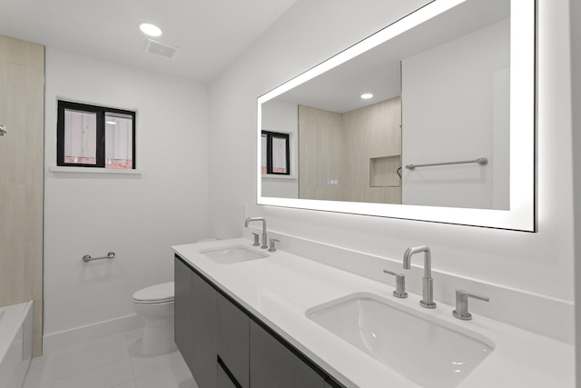 bathroom featuring toilet, baseboards, visible vents, and a sink