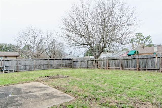 view of yard featuring a patio and a fenced backyard