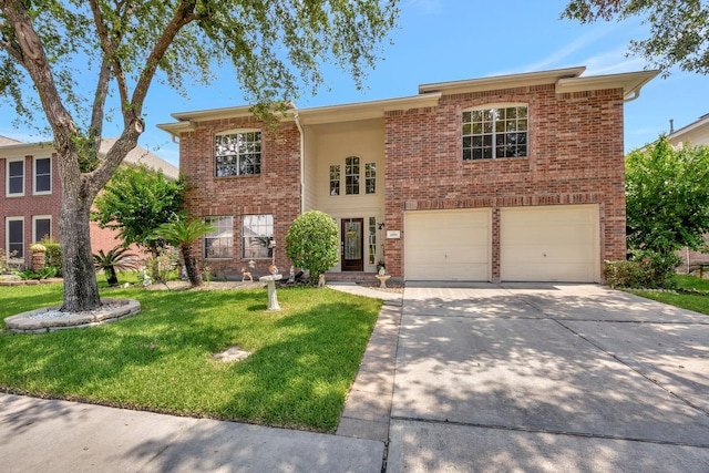 split foyer home featuring driveway, a garage, a front lawn, and brick siding