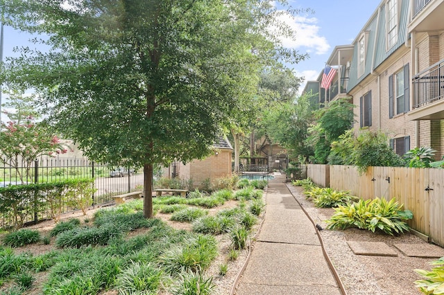 view of home's community with fence