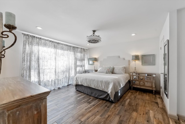 bedroom with wood finished floors and recessed lighting