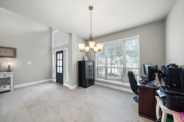 office space featuring an inviting chandelier, baseboards, and a wealth of natural light