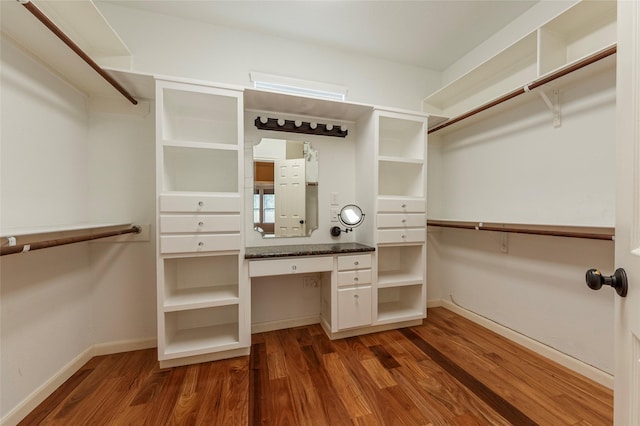 walk in closet featuring wood finished floors