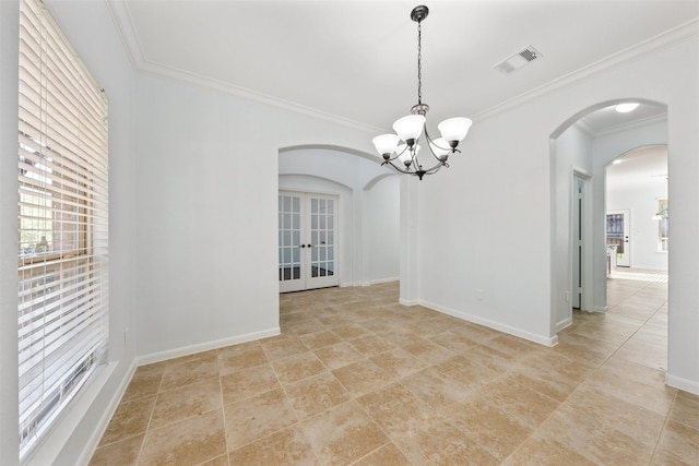 empty room featuring arched walkways, ornamental molding, visible vents, and baseboards